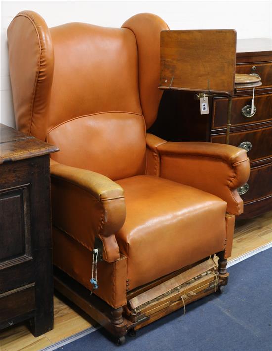 J. Foot and Son - A patent brown leather upholstered armchair
